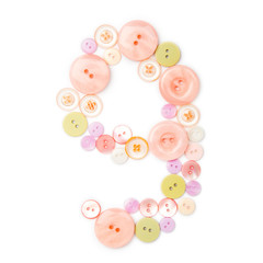 number 9 from pink and green buttons isolated on white. Sewing kit. Colorful button number nine, stylish alphabet for handmaking hobby. Handmade sew abc. Text from buttons. Sale of sewing furniture