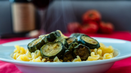 Italian food: pasta with zucchini and parmesan