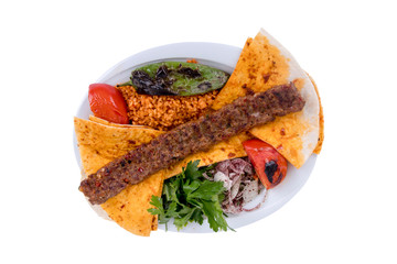 Turkish Adana Kebab with Vegetables on the Plate