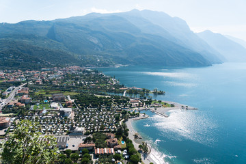 Fototapeta na wymiar A view from above at the city torbole in italy at the lake garda