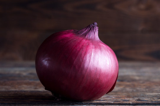 Red Onion On A Wooden Background. Red Baron