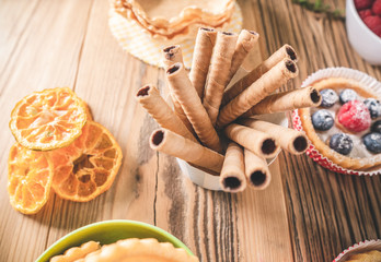 Wafer roll with pastries. Concept of delicious sweet food