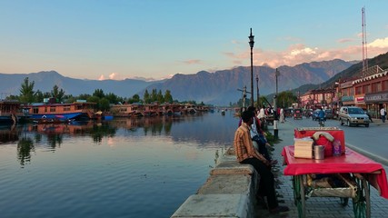 - An vendor sells spicy rice and vegetables on the shores of the lake to local tourists. 