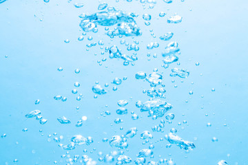 The bubbles under the blue water