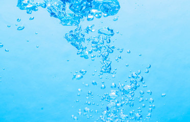 The bubbles under the blue water