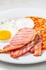English breakfast with bacon beans and egg