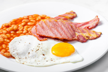 English breakfast with bacon beans and egg