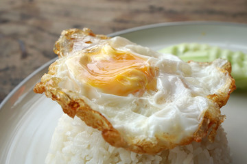  Thai food scene of Rice topped with Fried Egg