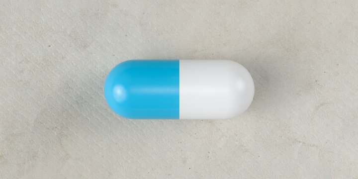 Single Blue Pill On Paper Background