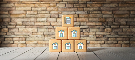 cubes with contract icon in front of brick wall on wooden floor