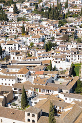 View of a Mediterranean town with all the white houses and buildings in Granada, southern Spain,