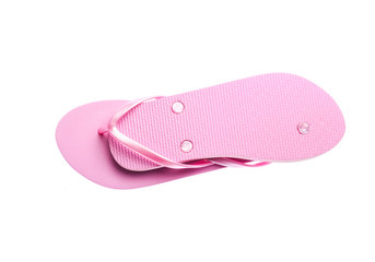 Pink plastic flip-flops isolated on a white background.