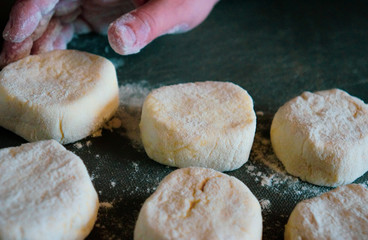 female hand in flour cooks cheesecakes
