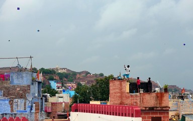 Jodhpur / India - 08.15.2019 : Children letting kids fly over the roofs 
