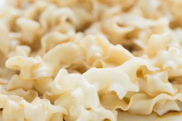 chinese style wide noodles pasta close up detail view