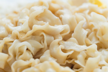 chinese style wide noodles pasta close up detail view