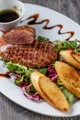 grilled duck breast with honey sauce and salad