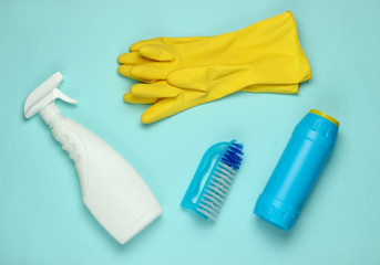 Set of products for cleaning the house on blue background. Top view.