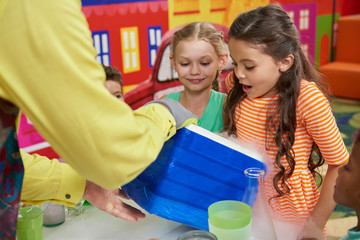 Scientific show for kids. Experiment with liquid nitrogen in playroom at entertainment center. Fun...