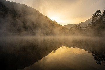 reflection in foggy water, kinrinko, oita, japan
