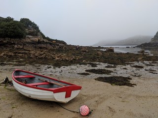 misty beach dramatic, boats, scilly isles
