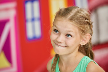 Close up portrait of a beautiful little girl. Happy caucasian kid. Childrens emotions concept.