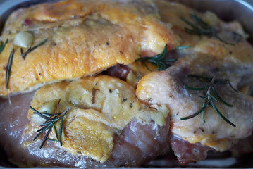 Raw guinea fowl with rosemary