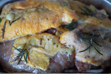 Raw guinea fowl with rosemary
