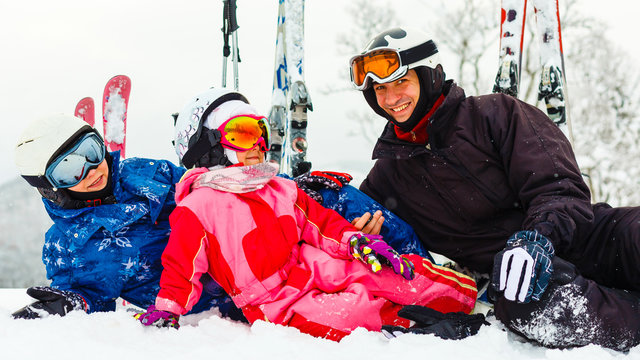Image of sporty family spending time on winter resort during vacations
