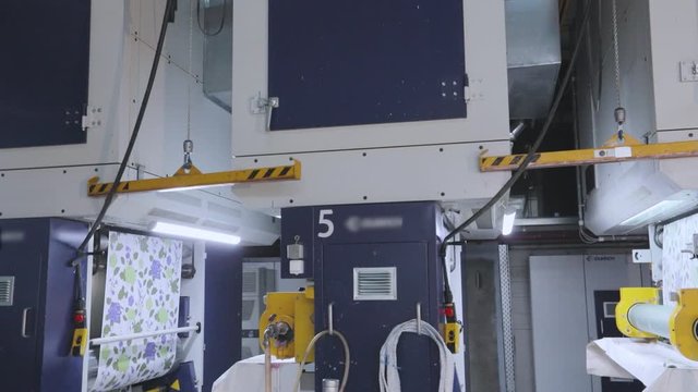 Modern conveyor for wallpaper production. Modern wallpaper production factory