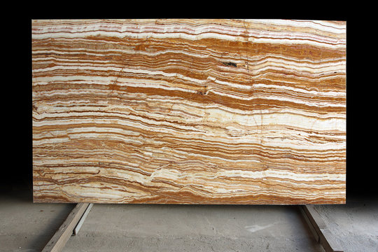 Natural stone from Italy with bright stripes of white and red color is called Onice Tiger