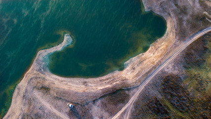 Camper at the Reservoir from Montargil view from above Ponte de Sor Portugal © Alice_D