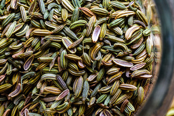 fennel seeds loose inside glass jar ready to be brewed as tea - obrazy, fototapety, plakaty