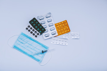  pills antibiotics and vitamins and protective medical face masks
