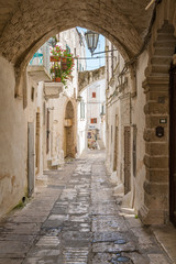 Scenic sight in Ostuni on a sunny summer day, Apulia (Puglia), southern Italy. 