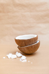 Raw coconut oil with fresh organic oil on neutral background