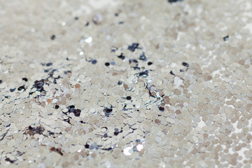 Silver explosion of confetti. Christmas festive background.