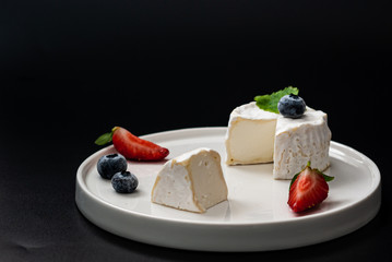 Farm Chaource white cheese with berries - soft french cow milk cheese