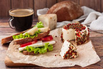 Assorted farm cheese with a cup of coffee - natural and healthy