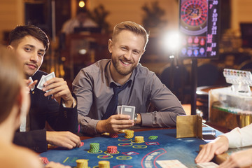 A group of young people gamble at a casino.