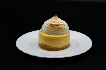 Nice citron cake with protein cream food sweet on white plate black background