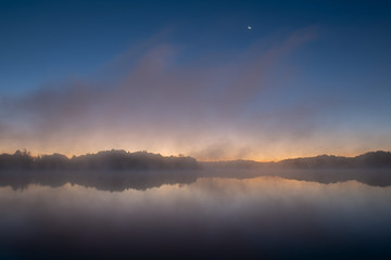 Moonrise, Whitford Lake in fog, Fort Custer State Park, Michigan, USA