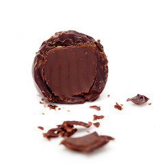 A half of truffle with chocolate crumbs isolated on white background