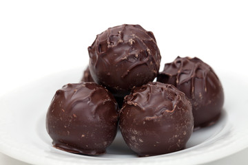 Dark chocolate truffles on a plate