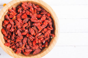 dried goji, cherry, raisin and plum fruits on white wood