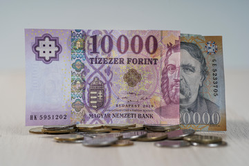 Various Hungarian Forint banknotes on coins.