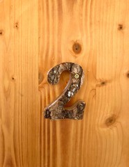 old wooden door with the number two made of wood
