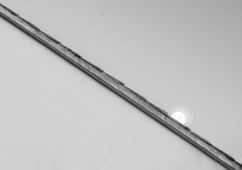 the moon over a roof