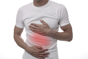 Man with stomach pain. Digestive system poblems, Food poisoning