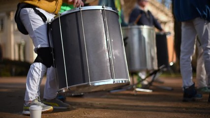 Playing drums. The drummer plays with sticks. Drumline marching band drum corps drummers closeup loop. Musician playing kettledrum